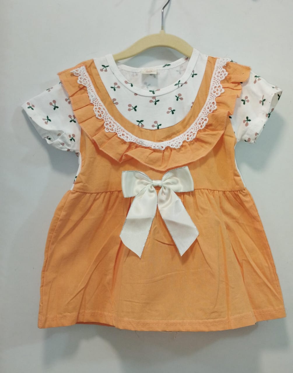 Peach and white frock with bow