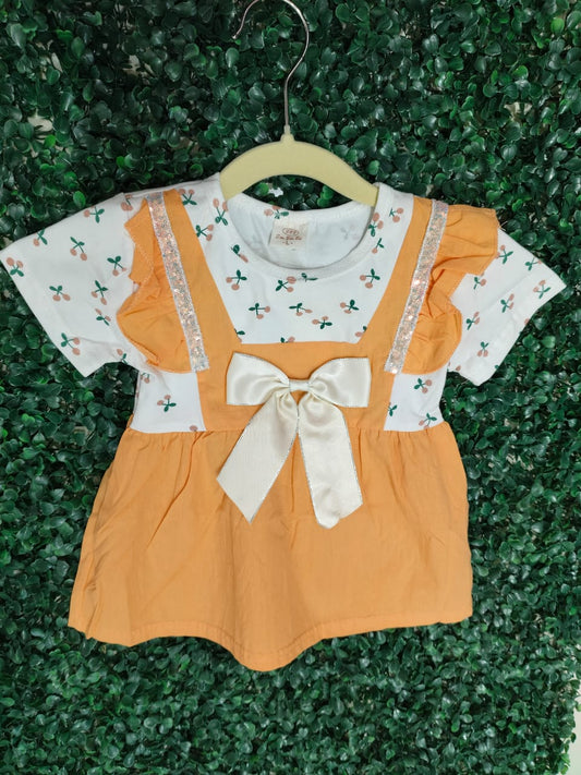 Peach and white frock with bow